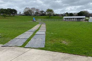 truck mats laid out on a sports field at wairau special school