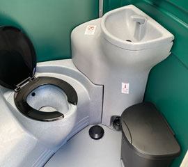 Fresh water portable toilet with hand basin in it