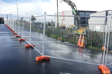 Temporary fencing around a commercial construction site in birkenhead